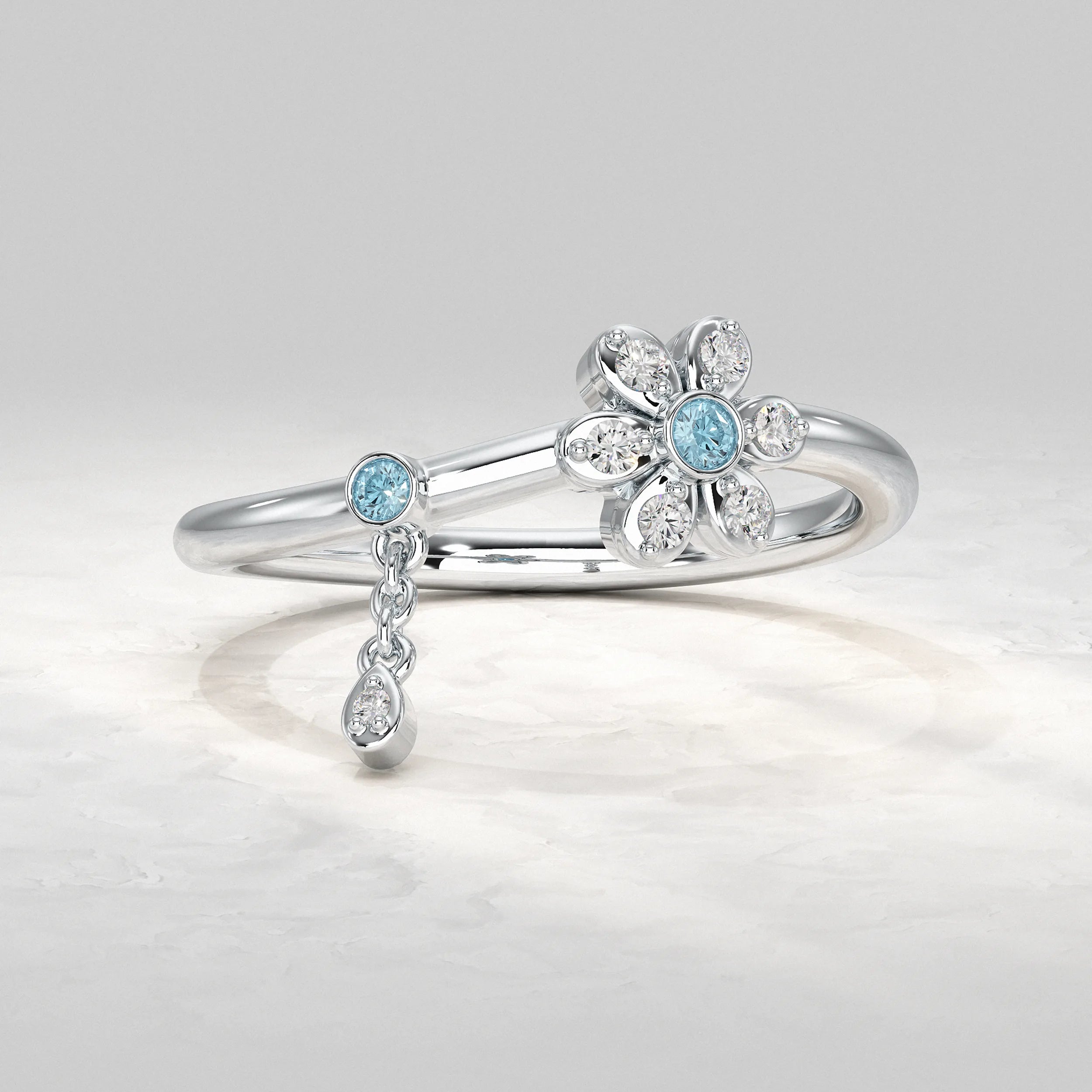 Silver-Ring-With-Floral-Cluster-And-Blue-Center-Stone